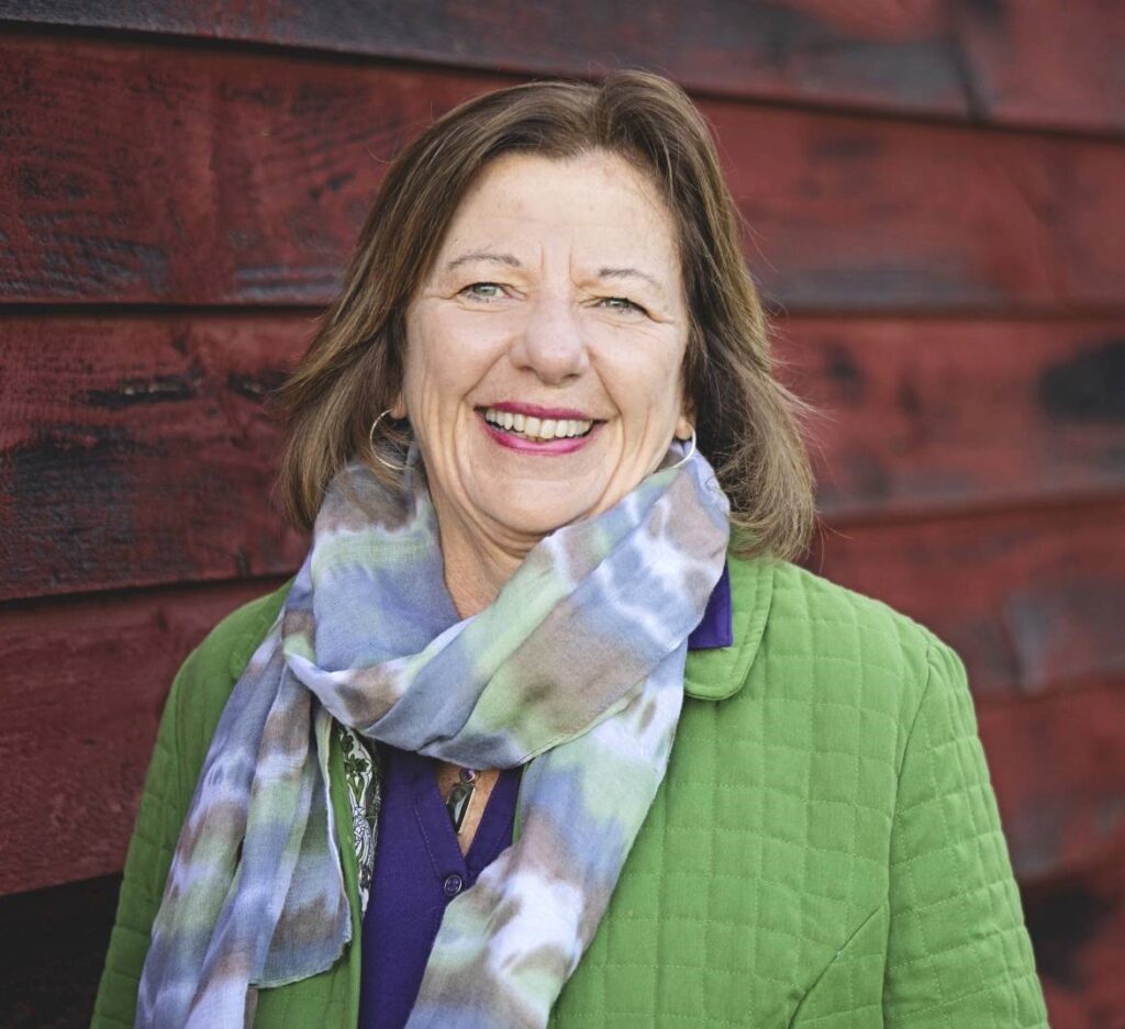 Diane in front of barn